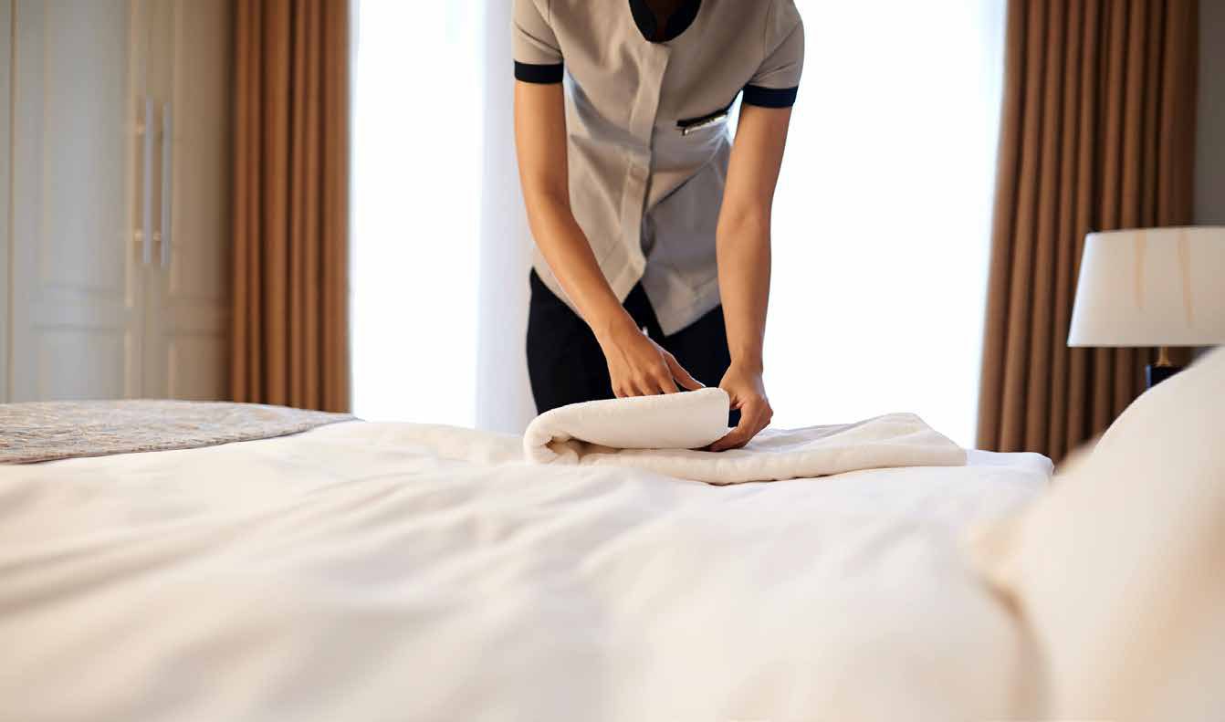 Housekeeping preparing fresh linens
